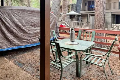 a table and chairs on a patio with a tent at Incline Village Creekside Retreat in Incline Village