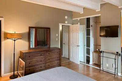 a bedroom with a television and a dresser with a dresser at Incline Village Creekside Retreat in Incline Village