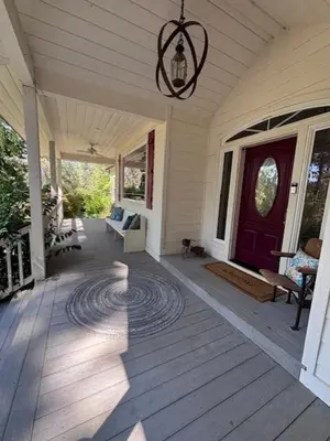 a front porch of a house with a purple door at The Firehouse Inn-Cottage in Mariposa