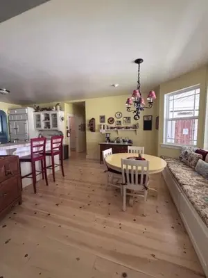 a kitchen and dining room with a table and chairs at The Firehouse Inn-Cottage in Mariposa