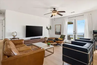 a living room with a couch and a flat screen tv at Incredible View Near Yosemite, Spacious 4BR House! in Coarsegold