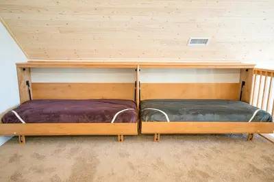 two bunk beds sitting inside of a room at River Rock Retreat in Yosemite West
