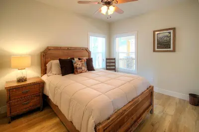 a bedroom with a bed and a ceiling fan at River Rock Retreat in Yosemite West