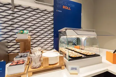 a display case with donuts and other pastries at Holiday Inn Express & Suites Jackson by IHG in Jackson