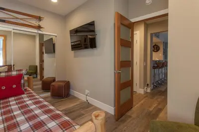 a room with a living room with a door and a living room at Snowcreek #881 - Phase V in Mammoth Lakes