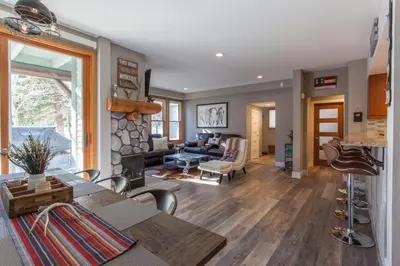 a living room with a table and chairs and a living room at Snowcreek #881 - Phase V in Mammoth Lakes