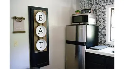 a kitchen with a refrigerator and a microwave at Lazy Z Resort in Twain Harte