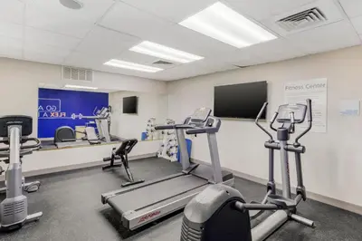 a gym with treadmills and machines in a room at Holiday Inn Express Fallon by IHG in Fallon