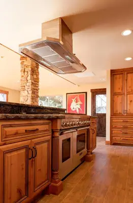 a large kitchen with a stove top oven at Mountain Shadows Retreat in Foresthill