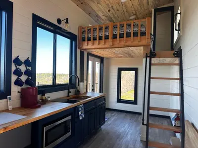a kitchen with a bunk bed in a tiny house at Mountain Shadows Retreat in Foresthill