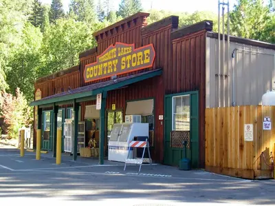 a building with a sign that reads survival store at Yosemite Lakes Wheelchair Accessible Cabin 46 in Harden Flat