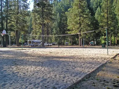 a volleyball court with a net in a park at Yosemite Lakes Cottage 49 in Harden Flat