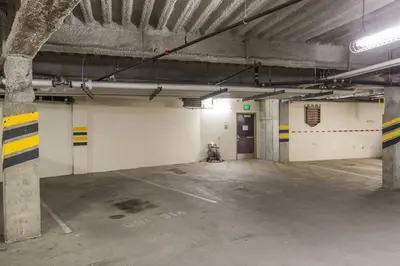 an empty parking garage with a large room with a door at Village Treehouse #2 in Mammoth Lakes
