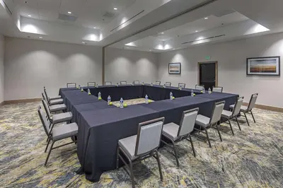 a large conference room with a long table and chairs at DoubleTree by Hilton Modesto in Modesto