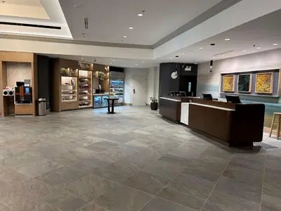 a lobby of a hotel with a check in counter at DoubleTree by Hilton Modesto in Modesto