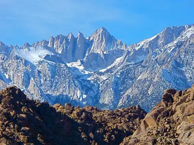 a view of a mountain range with snow at Starlight Motel in Big Pine