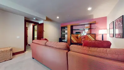 a living room with two brown leather couches at Juniper Crest 1 Apartment in Mammoth Lakes