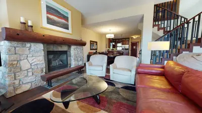 a living room with a couch and a fireplace at Juniper Crest 1 Apartment in Mammoth Lakes