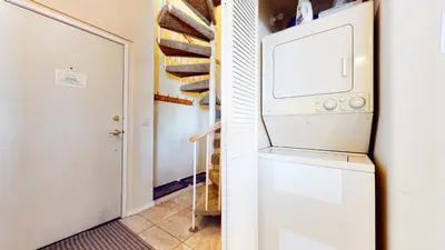 a laundry room with a washer and dryer at Mammoth Reservations in Mammoth Lakes