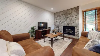 a living room with a couch and a fireplace at Snowcreek 441 Apartment in Old Mammoth