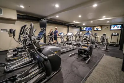 a gym with a bunch of tread machines in it at Snowcreek 441 Apartment in Old Mammoth