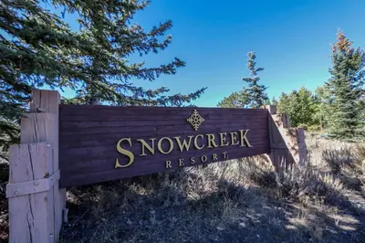 a sign for the snow sweepstakes resort at Snowcreek 638 Apartment in Old Mammoth