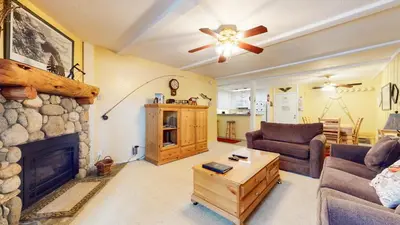 a living room with a couch and a fireplace at Summit 3 Apartment in Mammoth Lakes
