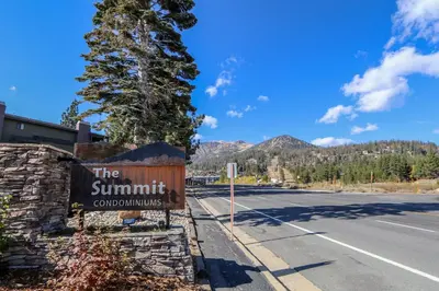 a sign for the summit countdownagency next to a road at Summit 3 Apartment in Mammoth Lakes
