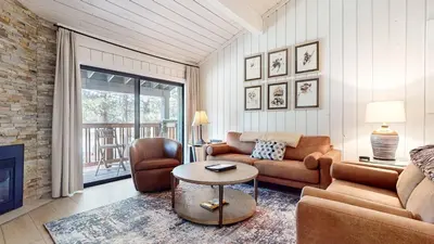 a living room with a couch and a table at Mammoth Reservations in Mammoth Lakes