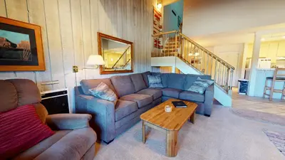 a living room with a couch and a table at Summit 34 Apartment in Mammoth Lakes