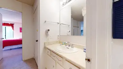 a bathroom with a sink and a mirror at Mammoth Reservations in Mammoth Lakes