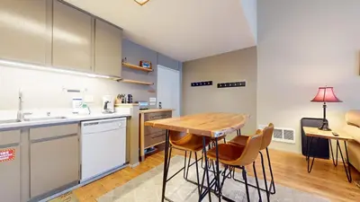 a kitchen with a wooden table and chairs at Mammoth Reservations in Mammoth Lakes