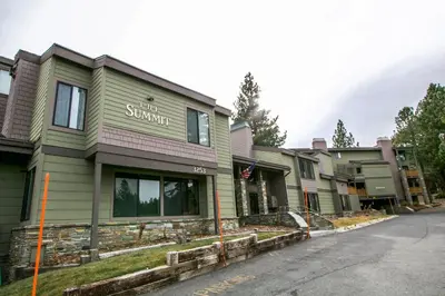 a row of houses on a street with a building at Mammoth Reservations in Mammoth Lakes