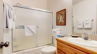 a bathroom with a shower and a sink at Mammoth Reservations in Mammoth Lakes