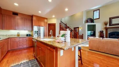 a kitchen with wooden cabinets and a counter top at Timbers 1 Apartment in Mammoth Lakes