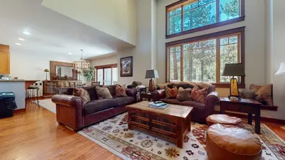 a large living room with couches and a table at Timbers 18 Apartment in Mammoth Lakes