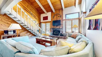 a living room with a couch and a fireplace at Wild Flower 6 Apartment in Mammoth Lakes