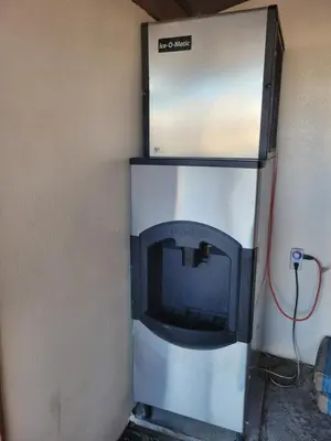 a refrigerator with a stove in the corner of a room at Townhouse Motel in Bishop