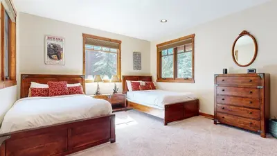 a bedroom with two beds and a mirror at Gray Stone 2088 Holiday home in Mammoth Lakes