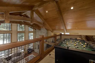 a large room with a pool table on a balcony at Stonegate 5 Holiday home in Mammoth Lakes