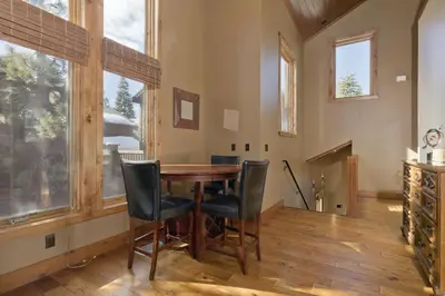 a dining room with a wooden table and chairs at Stonegate 5 Holiday home in Mammoth Lakes