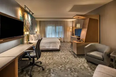 a hotel room with a bed and a desk at Courtyard by Marriott Reno Downtown/Riverfront in Reno