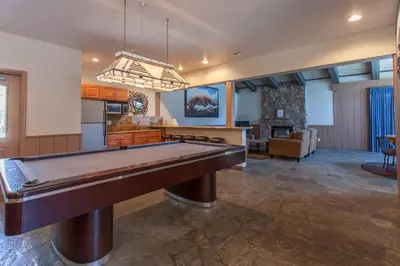 a large living room with a pool table at Chamonix # 88 in Mammoth Lakes