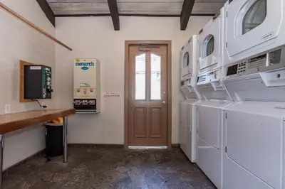 a laundry room with a washer and dryer at Chamonix # 88 in Mammoth Lakes