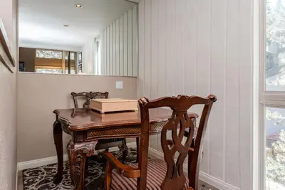 a dining room with a wooden table and chairs at Chamonix # 88 in Mammoth Lakes