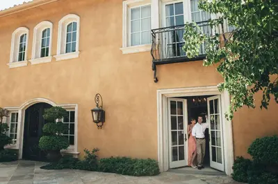 two people standing in the doorway of a house at Villa Arden Hills in Sacramento