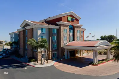 a rendering of a hotel with a parking lot at Holiday Inn Express Fresno South by IHG in Fresno