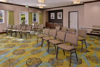 a conference room with chairs and a table at Holiday Inn Express Fresno River Park Highway 41 by IHG in Fresno