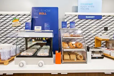 a bakery with donuts on display in a store at Holiday Inn Express & Suites Sacramento NE Cal Expo by IHG in Sacramento