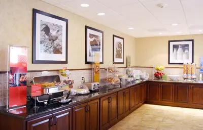 a kitchen with a counter with food on it at Hampton Inn & Suites Lodi in Lodi
